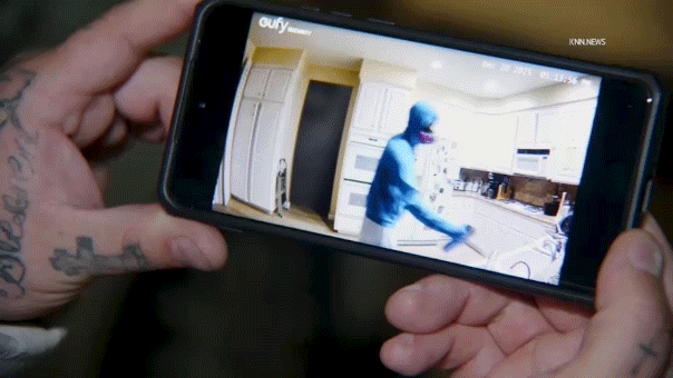 Video appears to show gas mask-wearing roommate allegedly spraying poison on couple