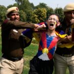 Tibetans scuffle with police outside the Chinese Embassy in India as they mark uprising anniversary