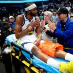 Warriors' Moses Moody leaves game on stretcher after suffering gruesome injury on dunk attempt