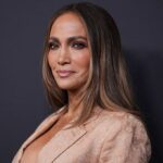 Jennifer Lopez flashes her toned abs in tiny white bikini as she enjoys pool time session