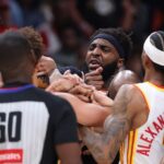 Two players ejected after scrum amid Knicks' 50-point lead vs. Hawks sends referee crashing to the court