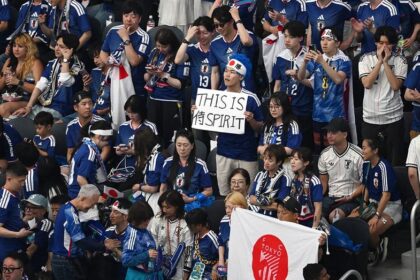 Japanese World Cup fans clean up stadium with NFL quarterback after team draws with the Netherlands