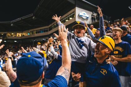 West Virginia's epic walk-off sparks emotional 'Country Roads' celebration that defines college sports