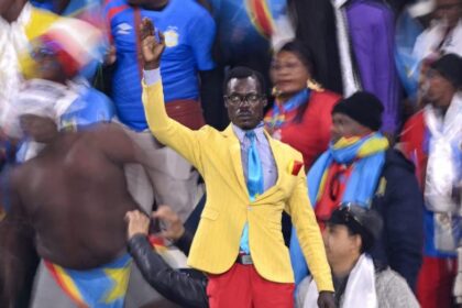 Why Does 'Lumumba Vea,' DR Congo's 'Statue Man,' Stand The Whole Match?